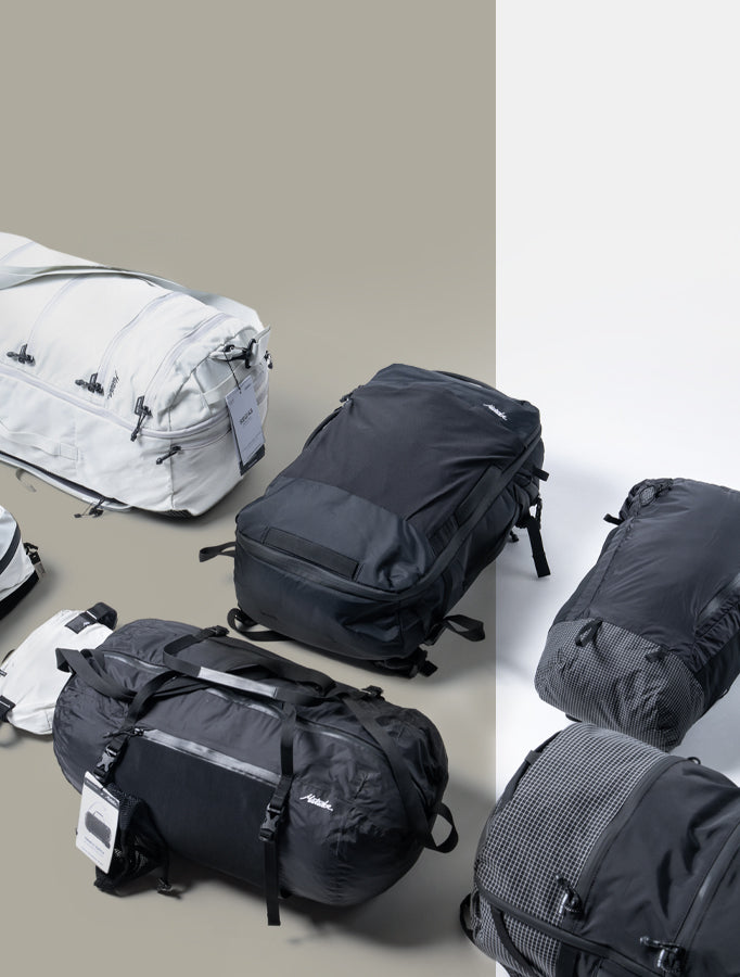 backpacks on a white and tan background