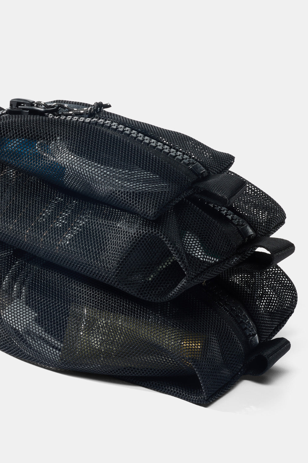 pile of full mesh bags on white backround