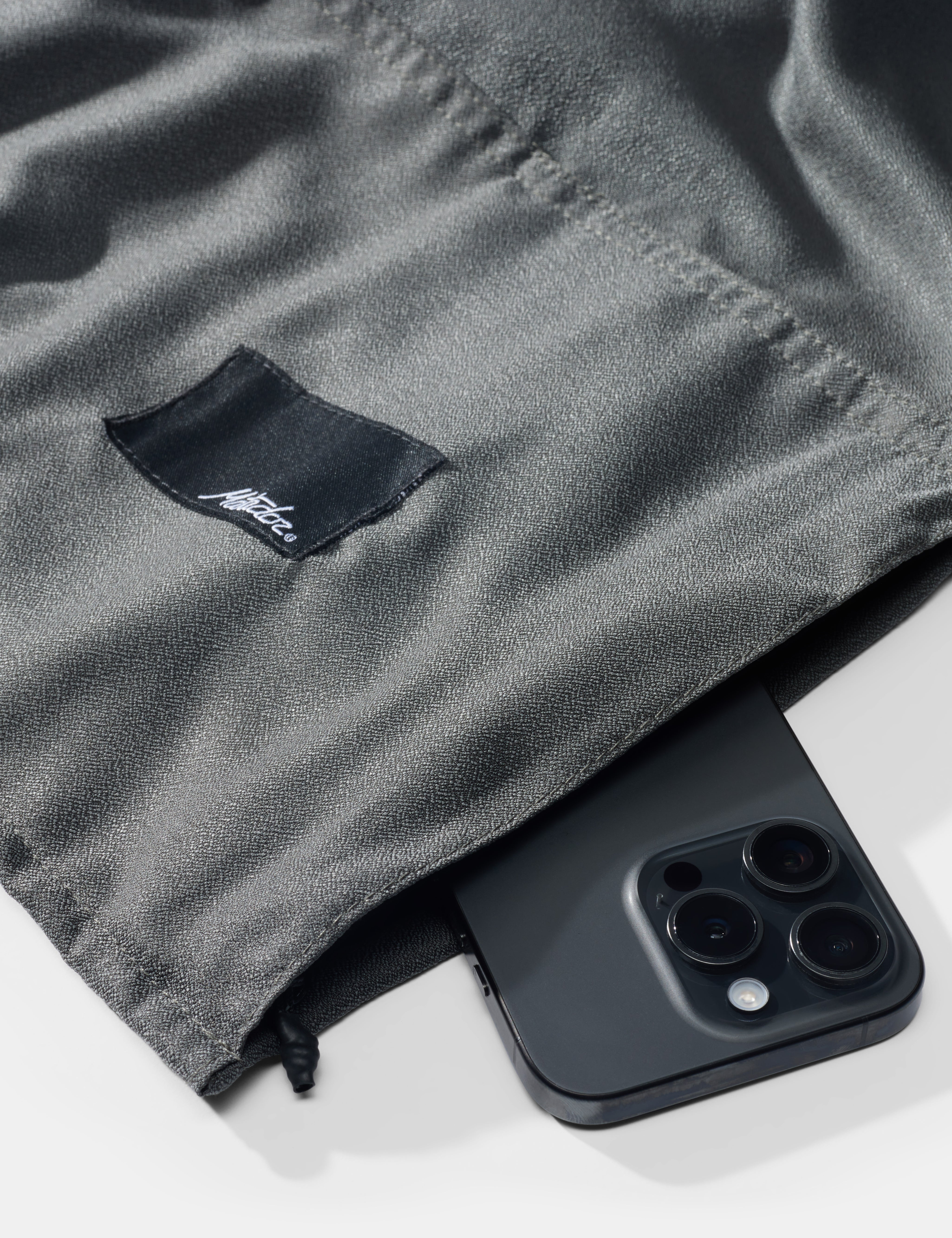 Black phone  on a gray fabric background