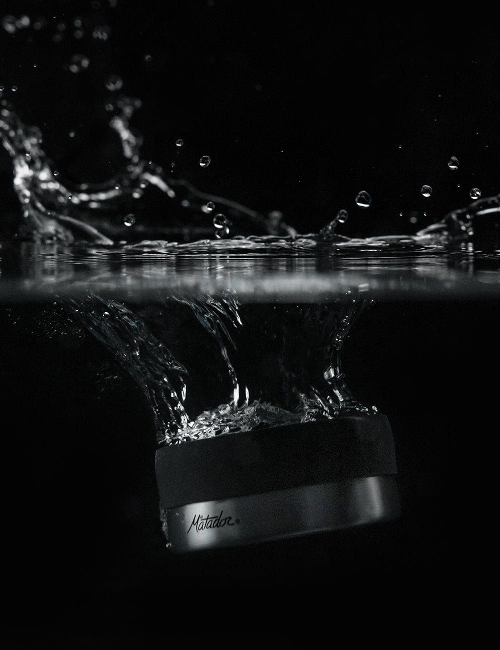 waterproof canister splashing into water