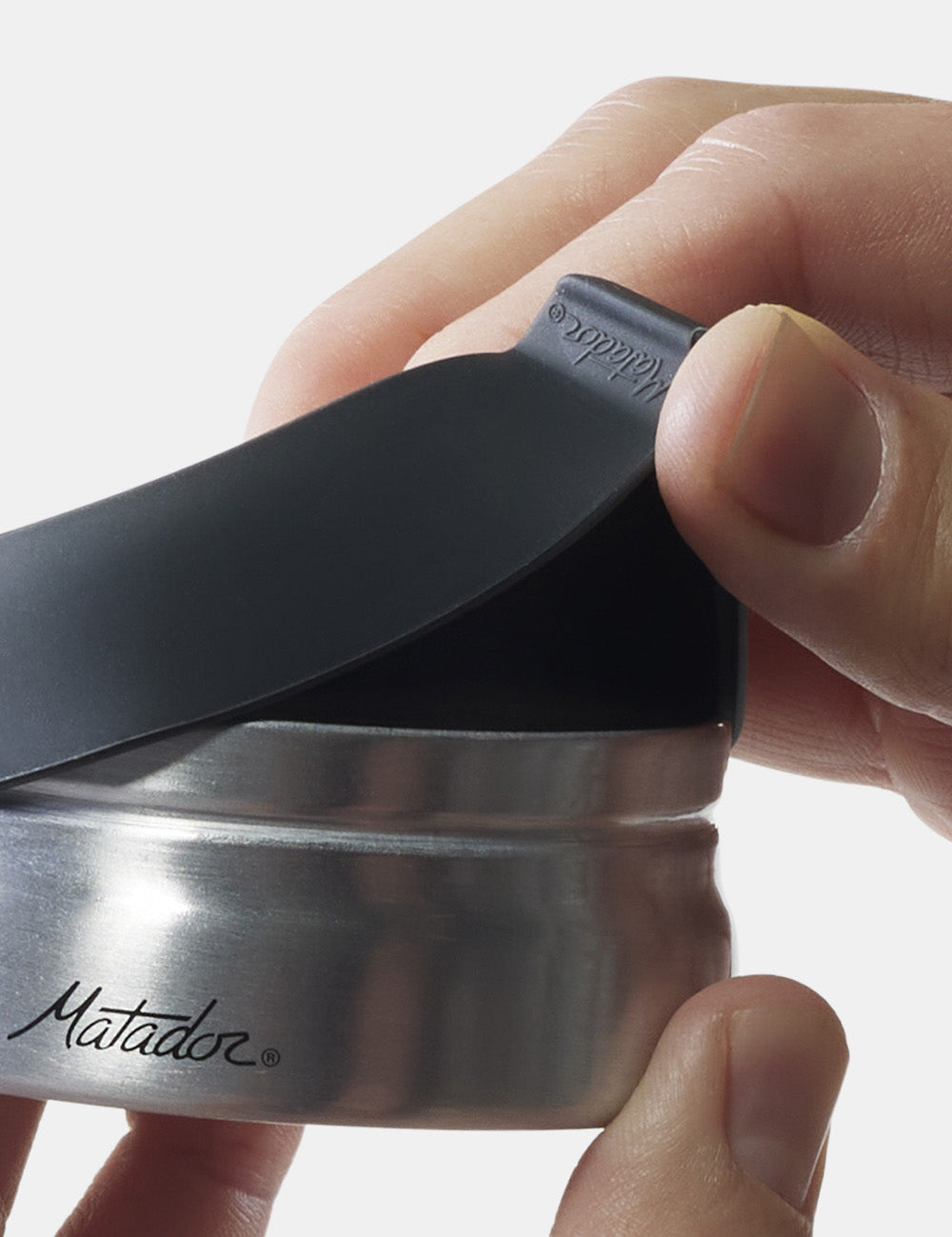 hands using pull tab to open canister