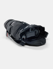 Black protective gear with a camera inside on a white background