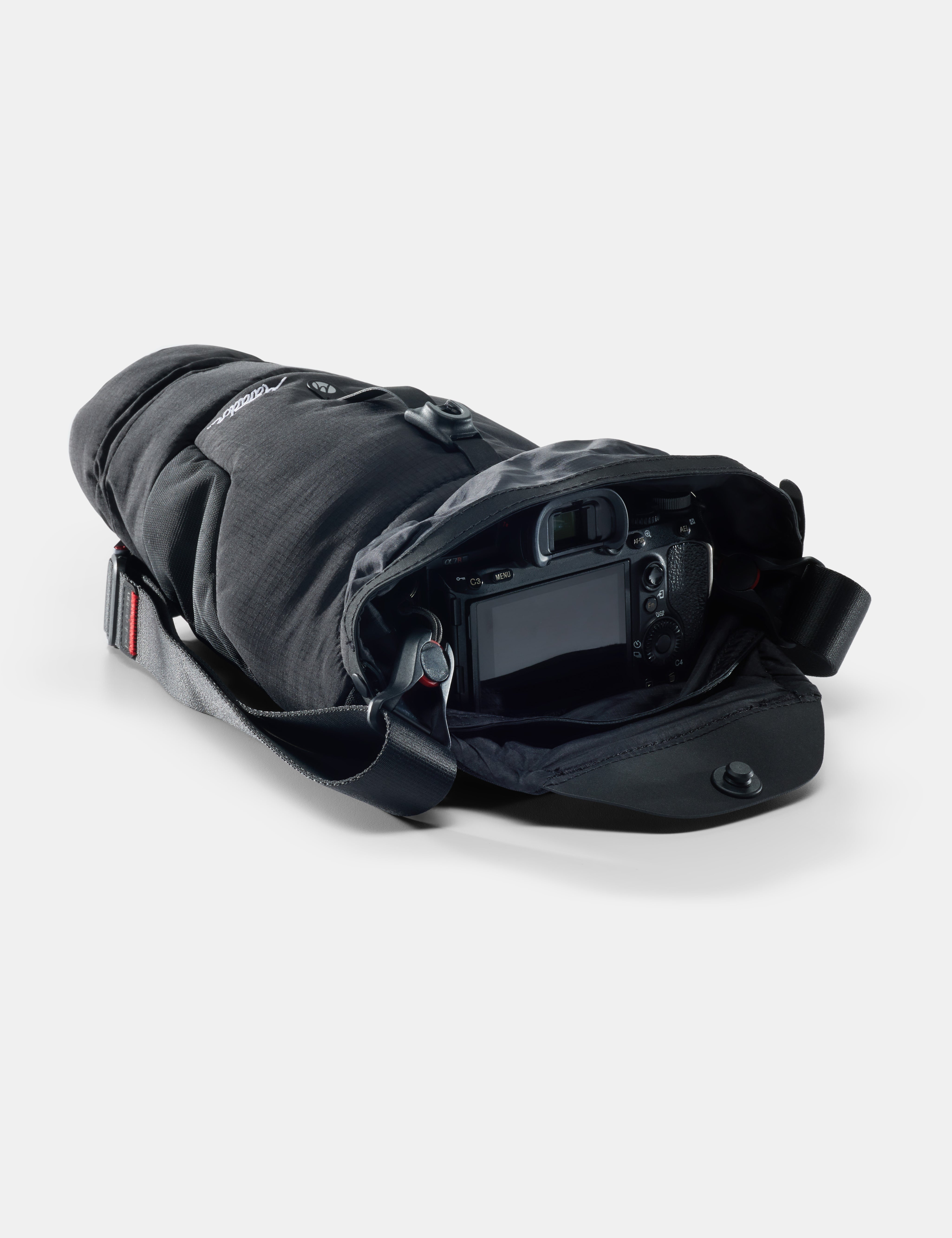 Black protective gear with a camera inside on a white background