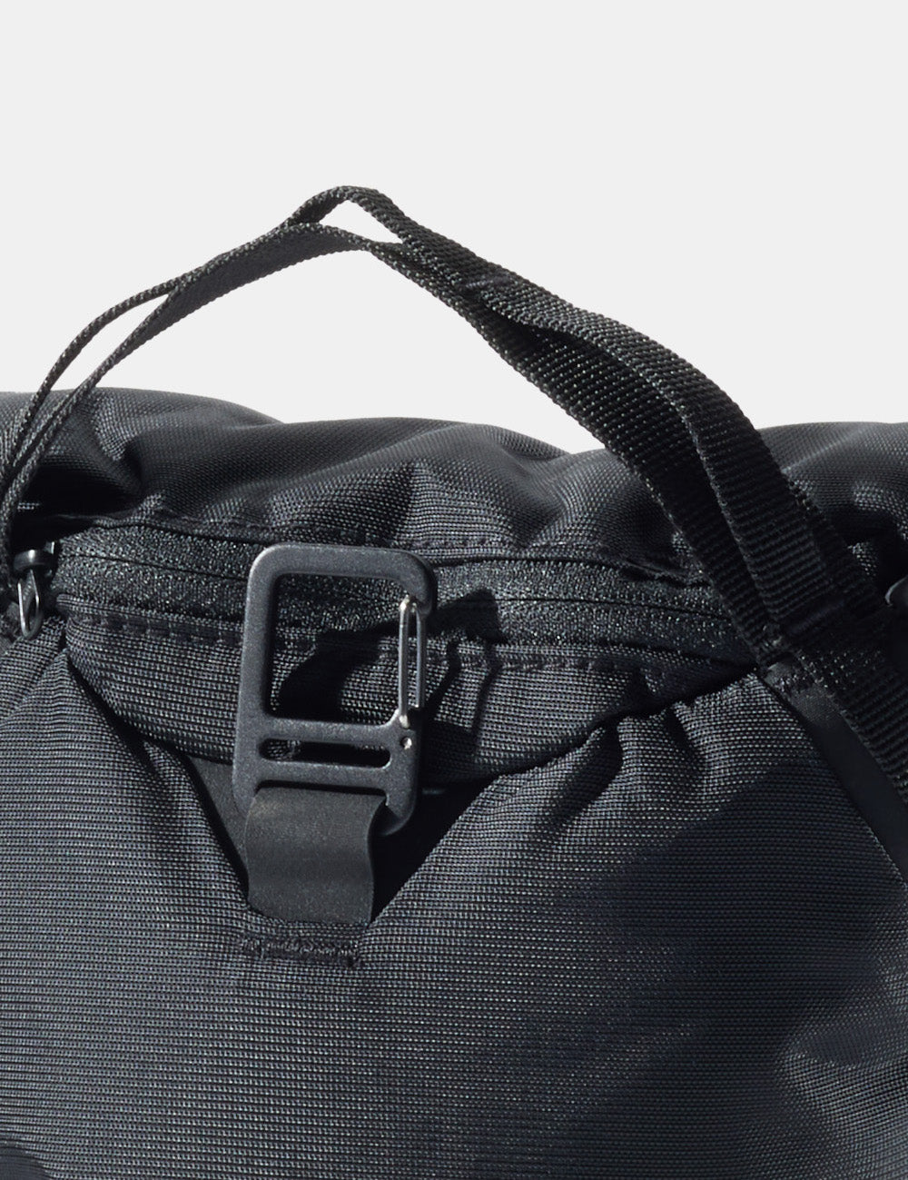 detail view of carabiner on camera base layer