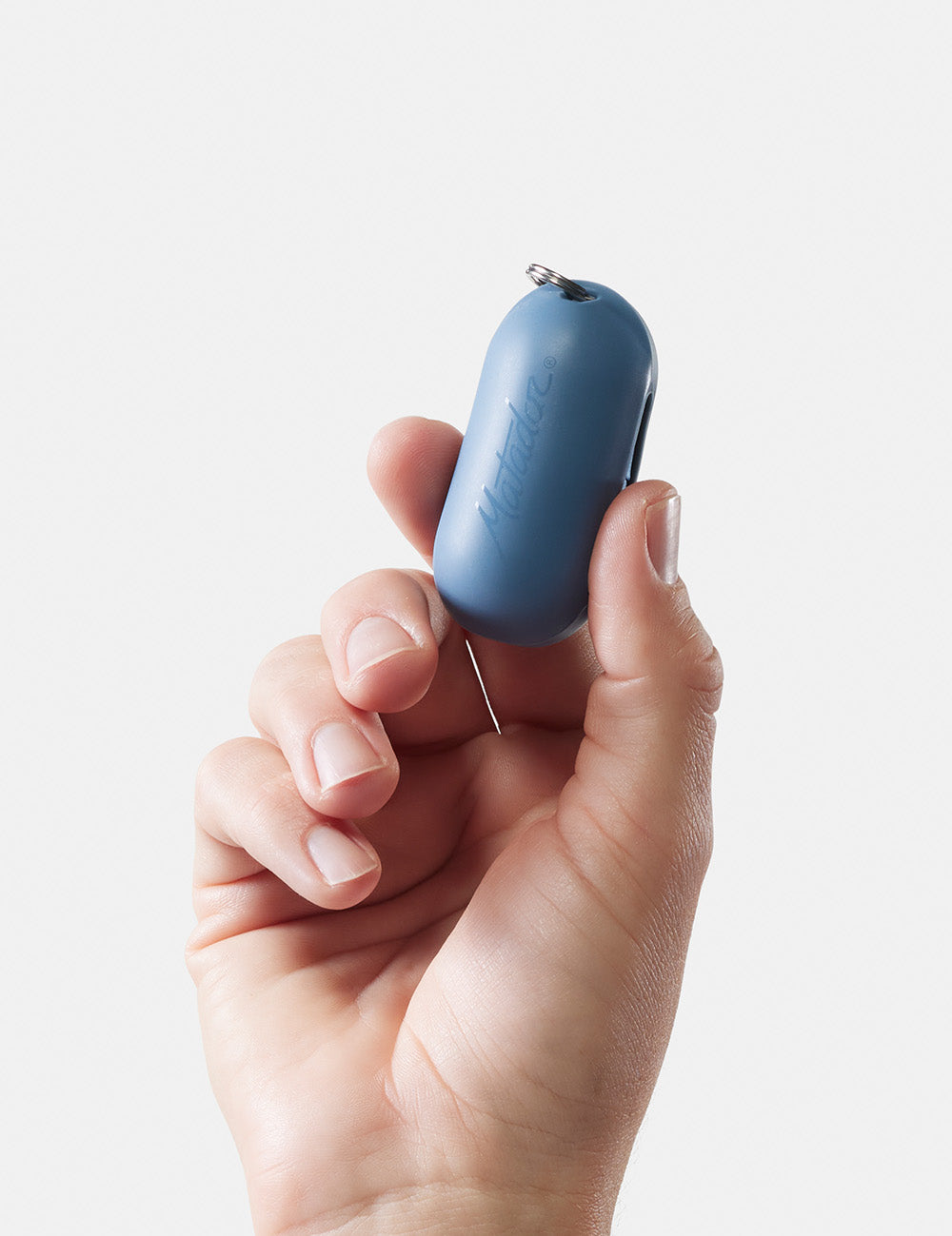 Close up view of hand holding blue droplet case