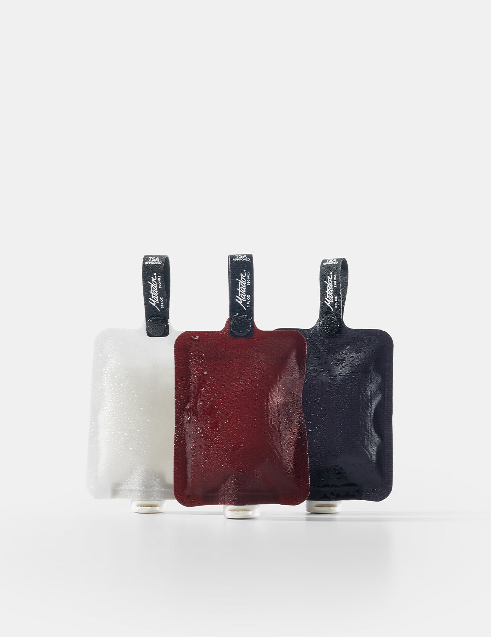 Three rectangular pouches in red, black, and white on a white background