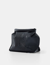 Black toiletry case on a white background