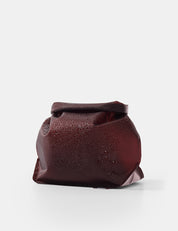 garnet toiletry case on white background