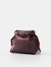 garnet toiletry case on white background