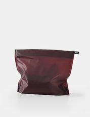 garnet toiletry case on white background