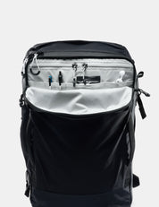 Black backpack with open front compartment on a white background