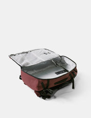 Red backpack with open front compartment on a white background