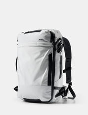 White backpack with black straps on a white background