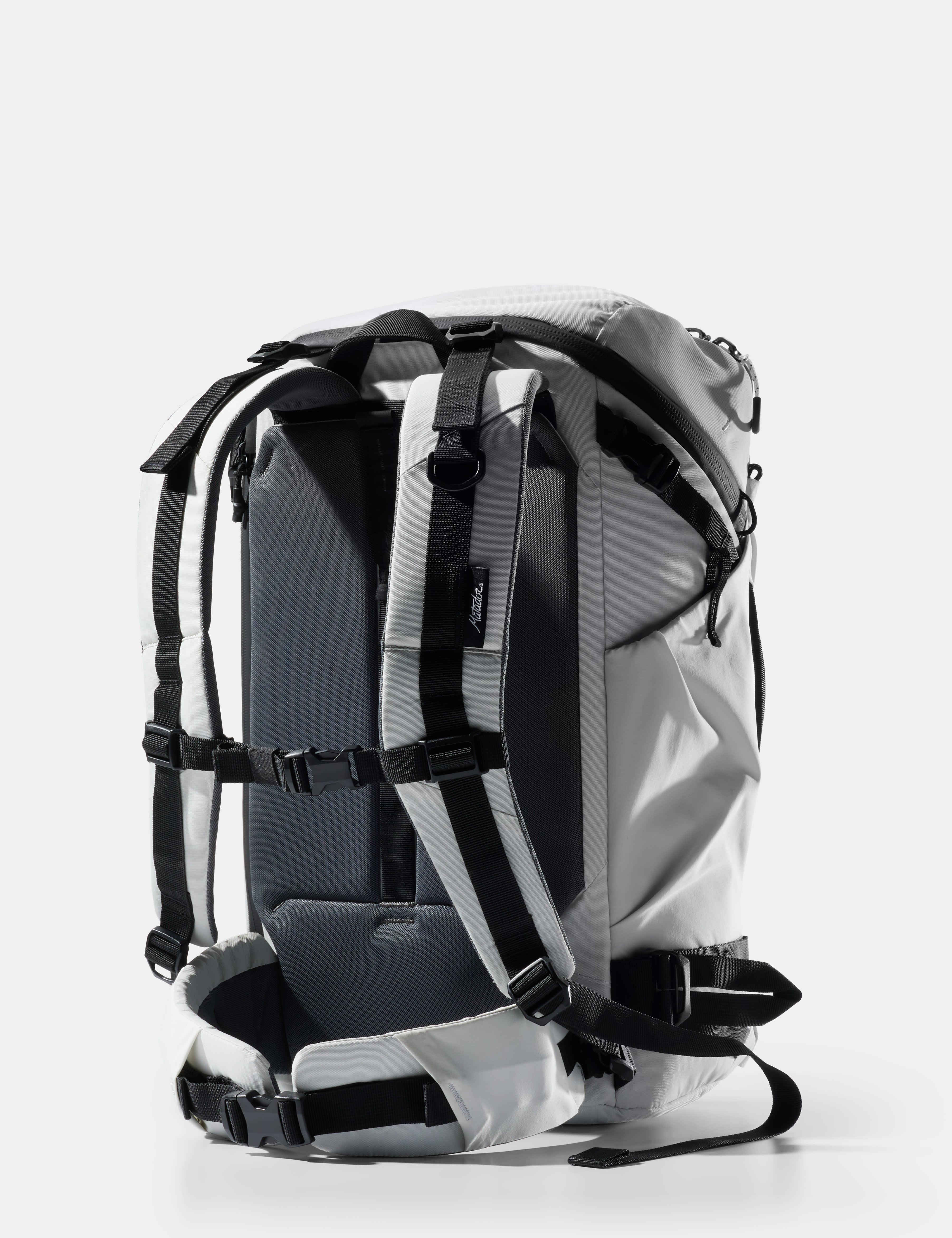 Gray backpack with black straps on a white background