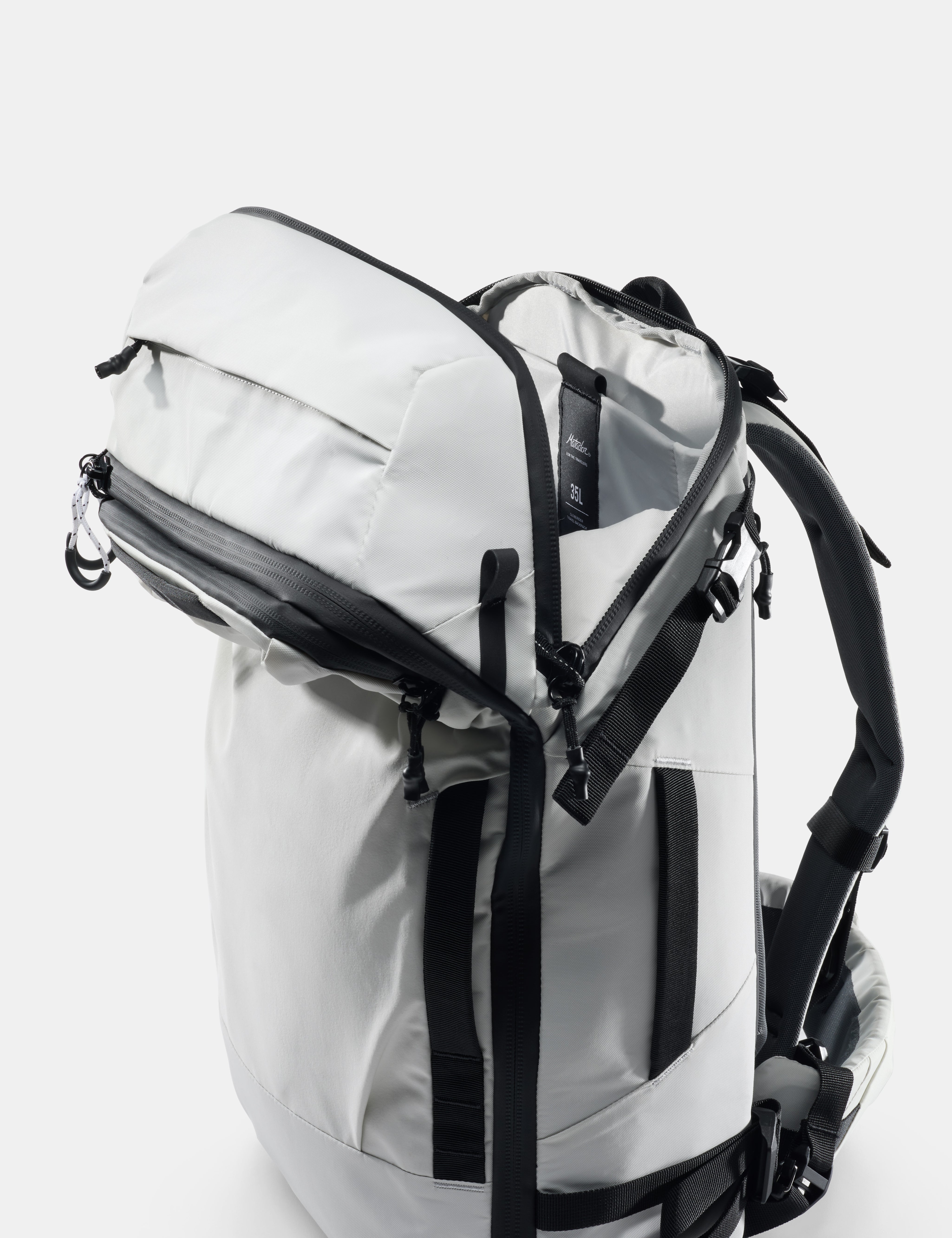 White backpack with black straps on a white background