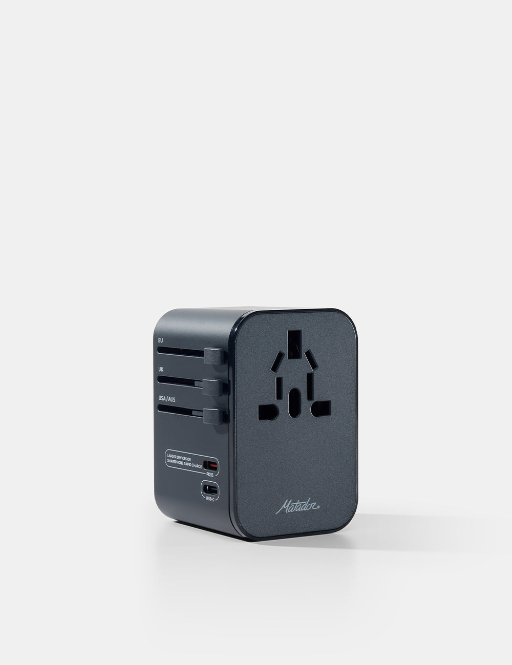 Black travel adapter on a white background
