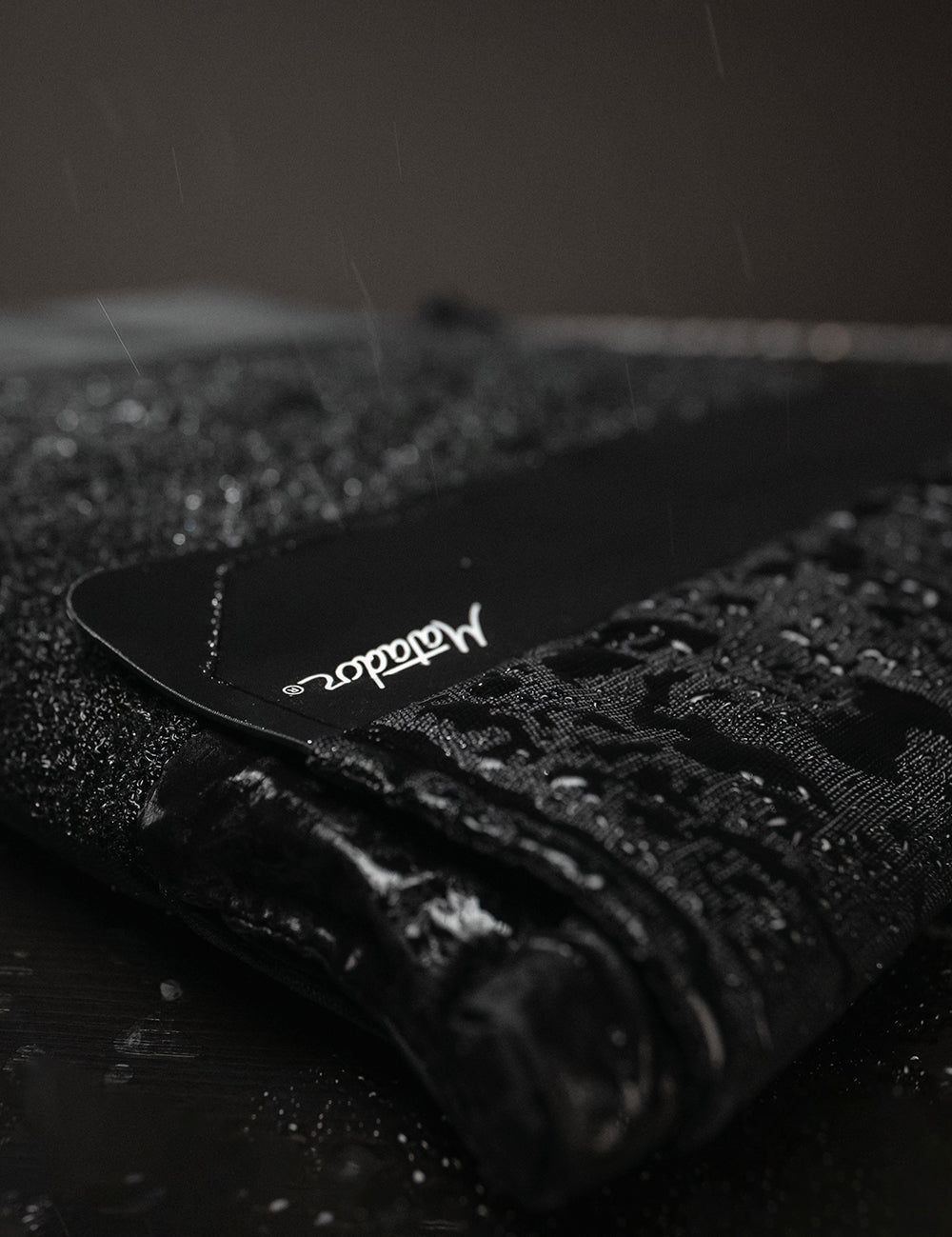 close up view of water beading off laptop base layer