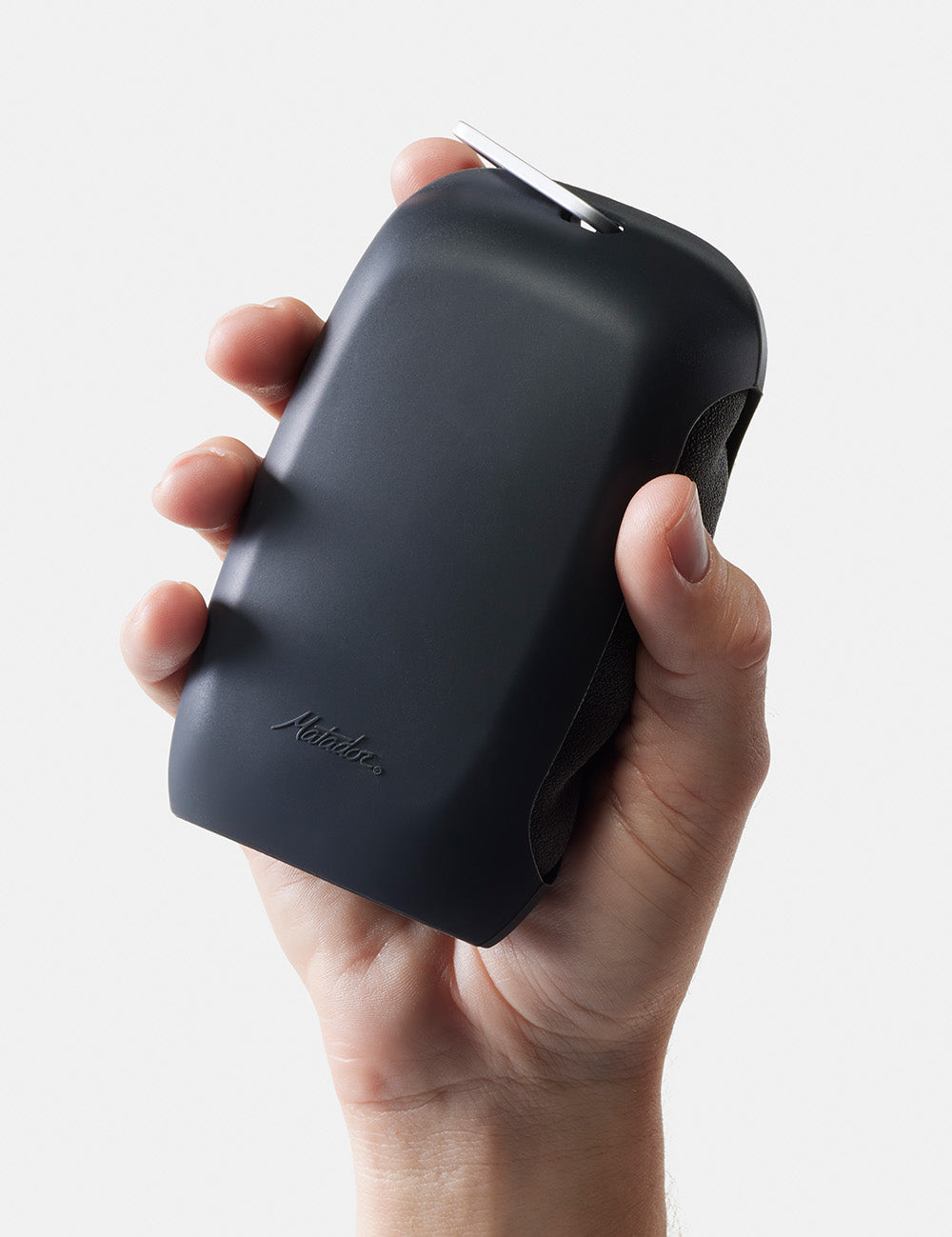 hand on white background holding up silicone towel case