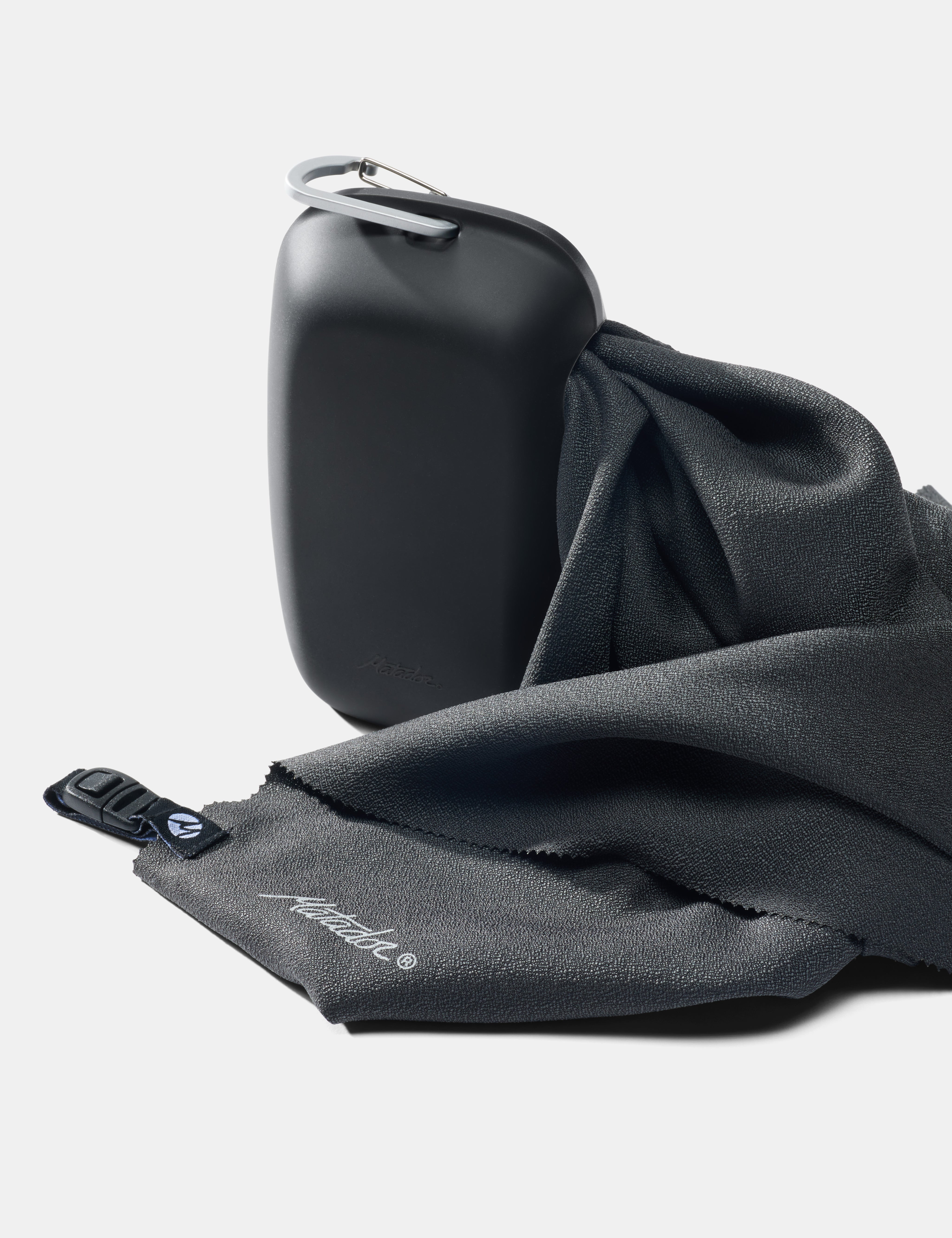 gray towel and case with carabiner clip on a white background