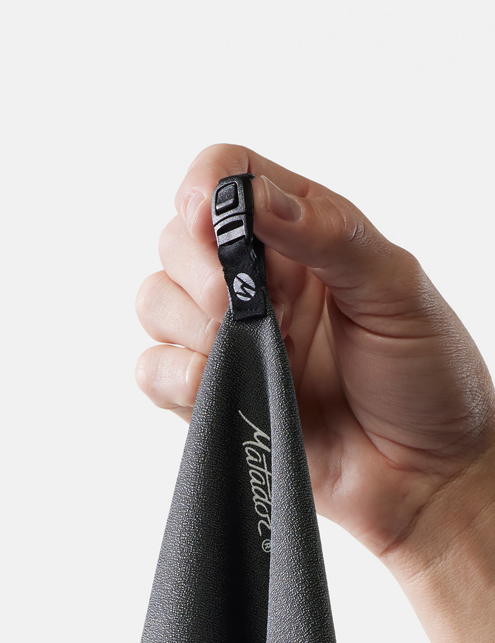 close up view of towel hang loop buckle hanging from finger