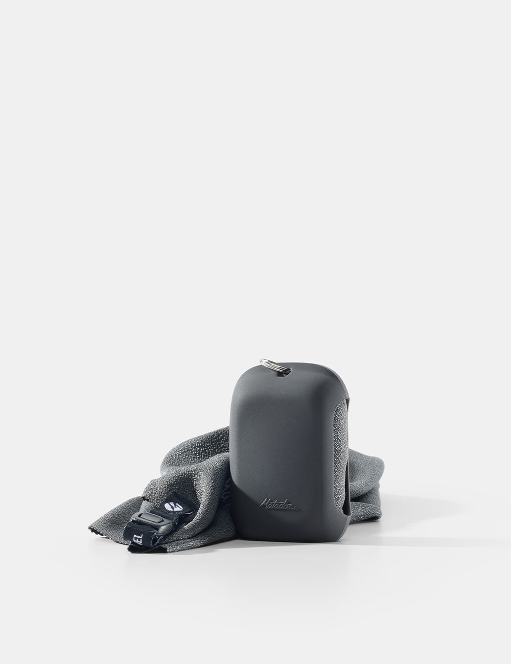 Gray towel case and towel on a white background