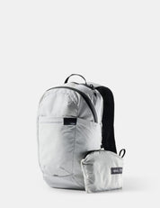 Light gray backpack with a smaller pack attached on a white background
