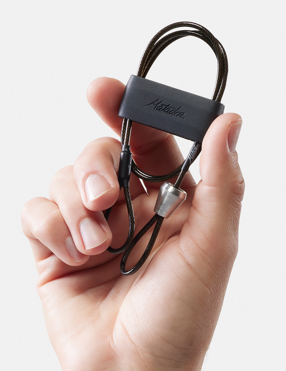 hand holding up coiled betalock accessory cable