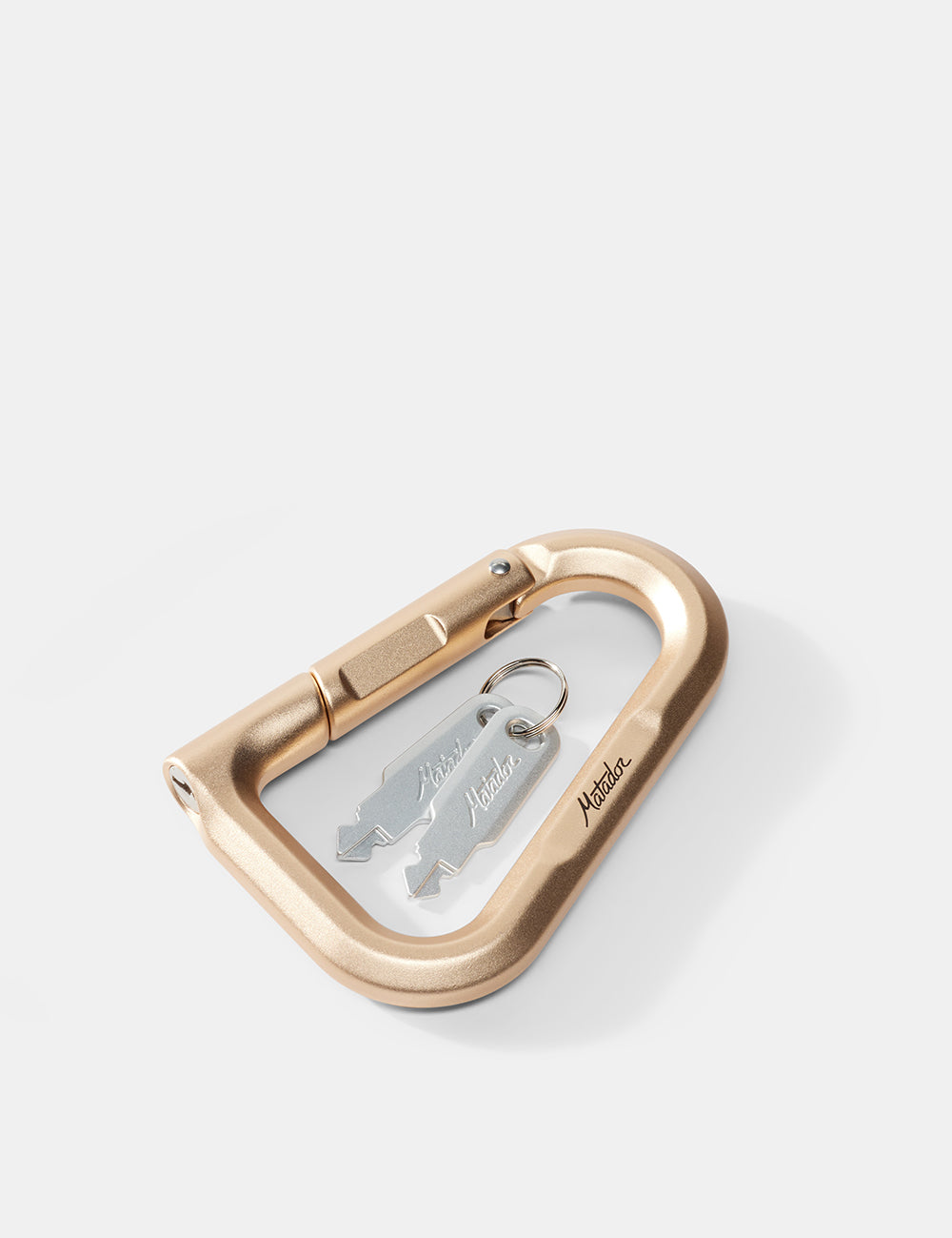 gold carabiner with a keychain on a white background