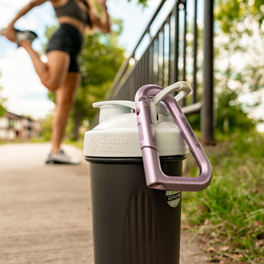 purple carabiner hanging off blender bottle