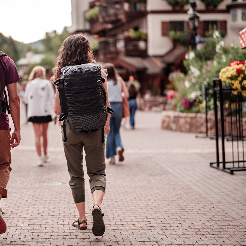 woman walking through Bavarian town wearing black seg28