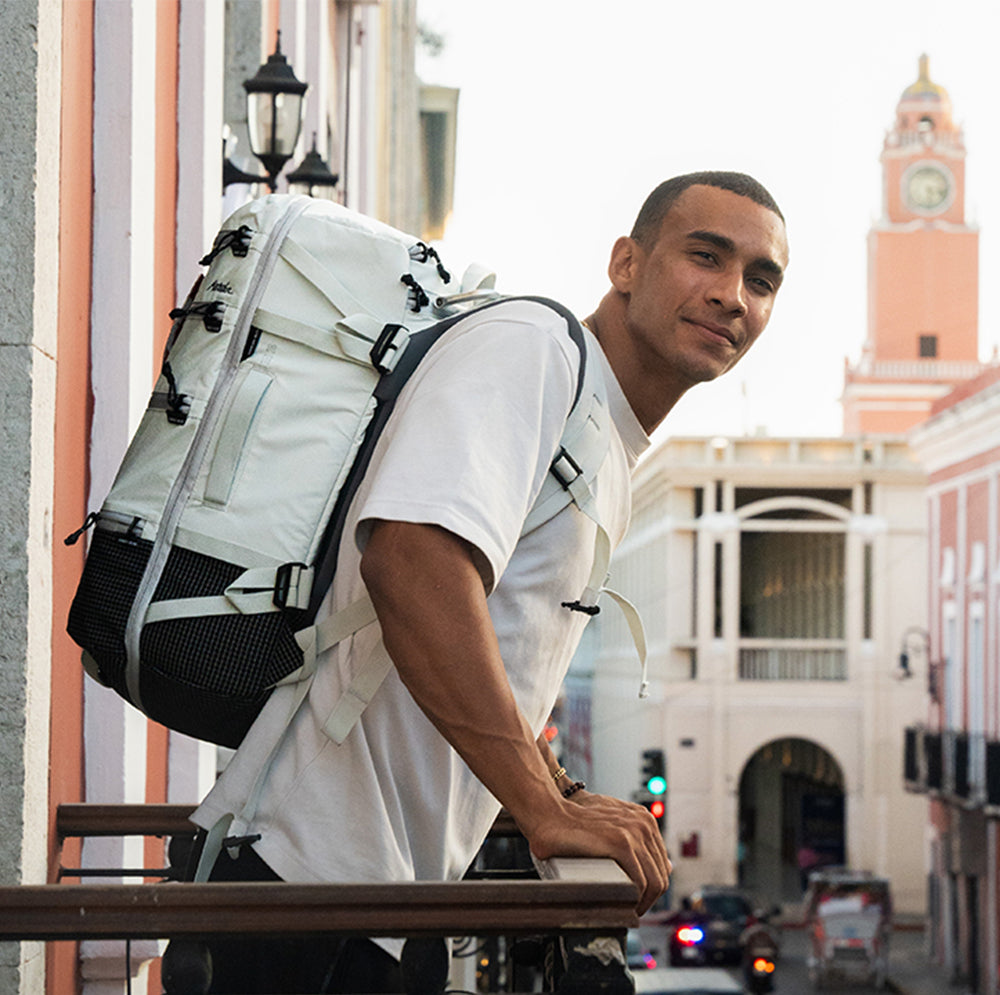 Man on mexico city balcony weaing white seg28
