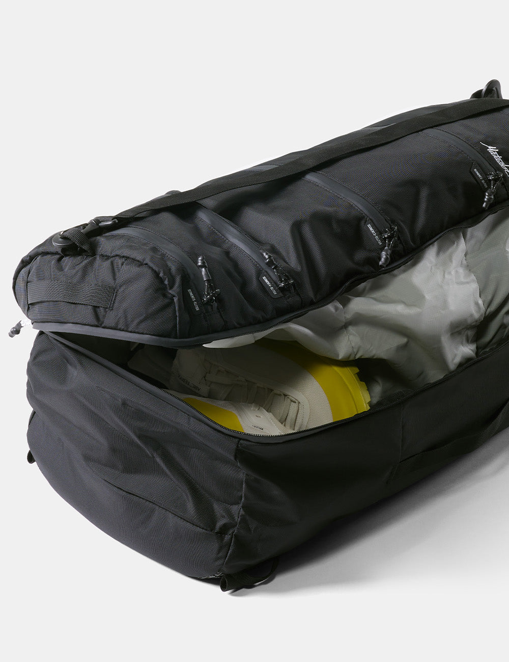 partially open clamshell of seg45 revealing neon yellow shoes