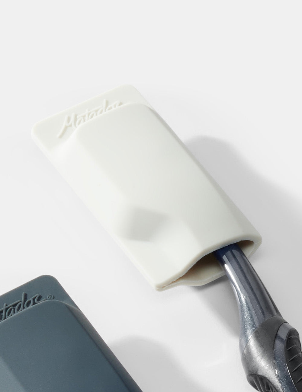 light gray toothbrush cap on white background