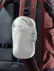 white speed stash on garnet backpack strap