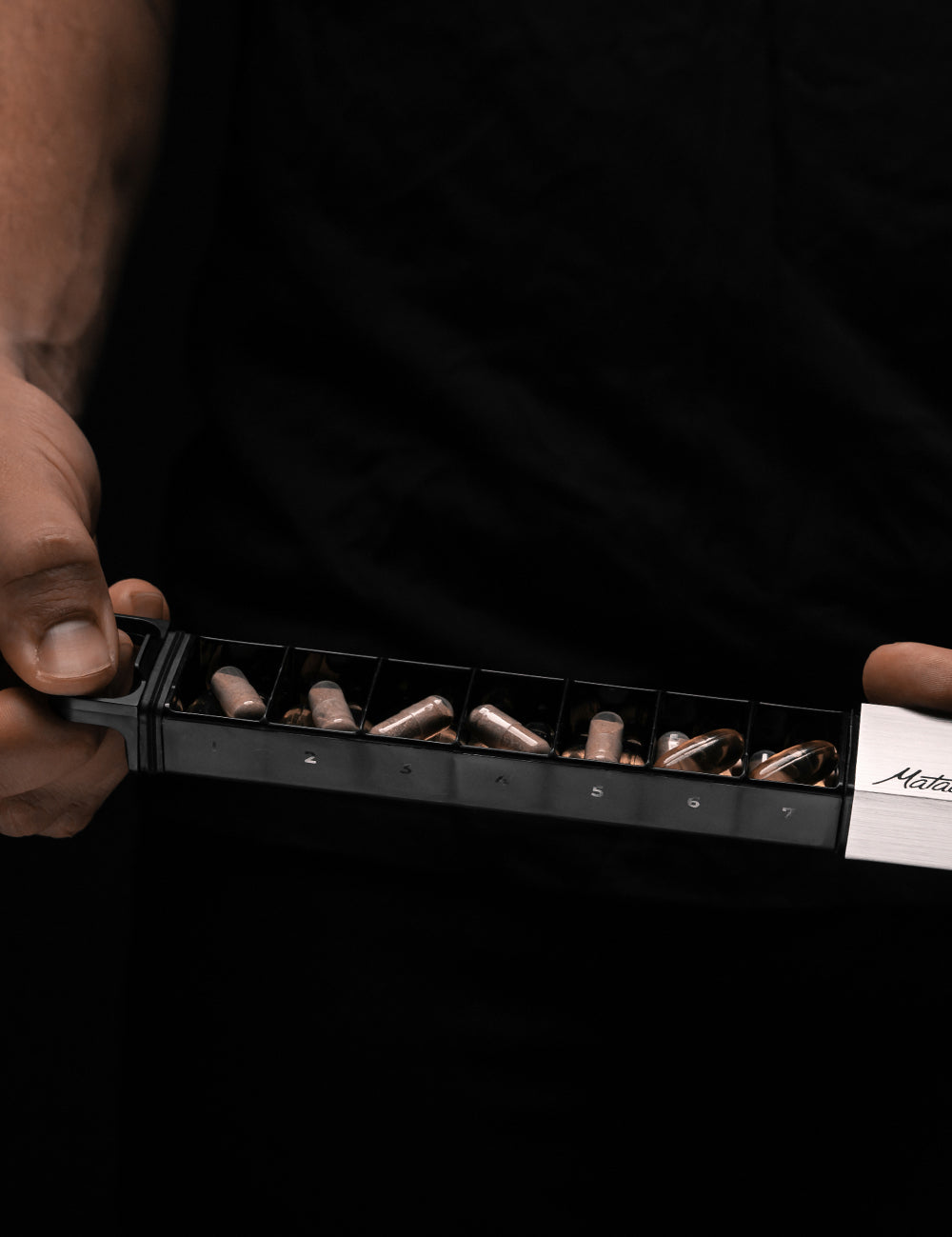 all 7 compartments of the pill canister filled with pills