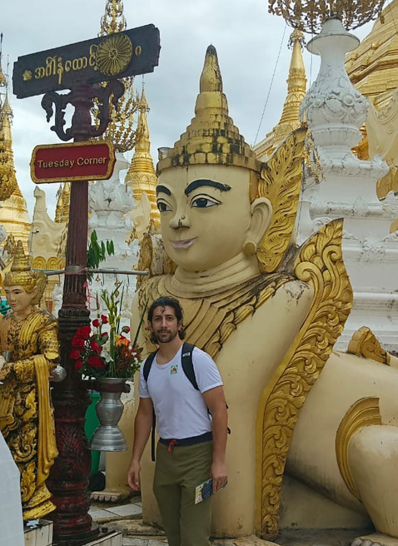 man wearing a backpack at a temple