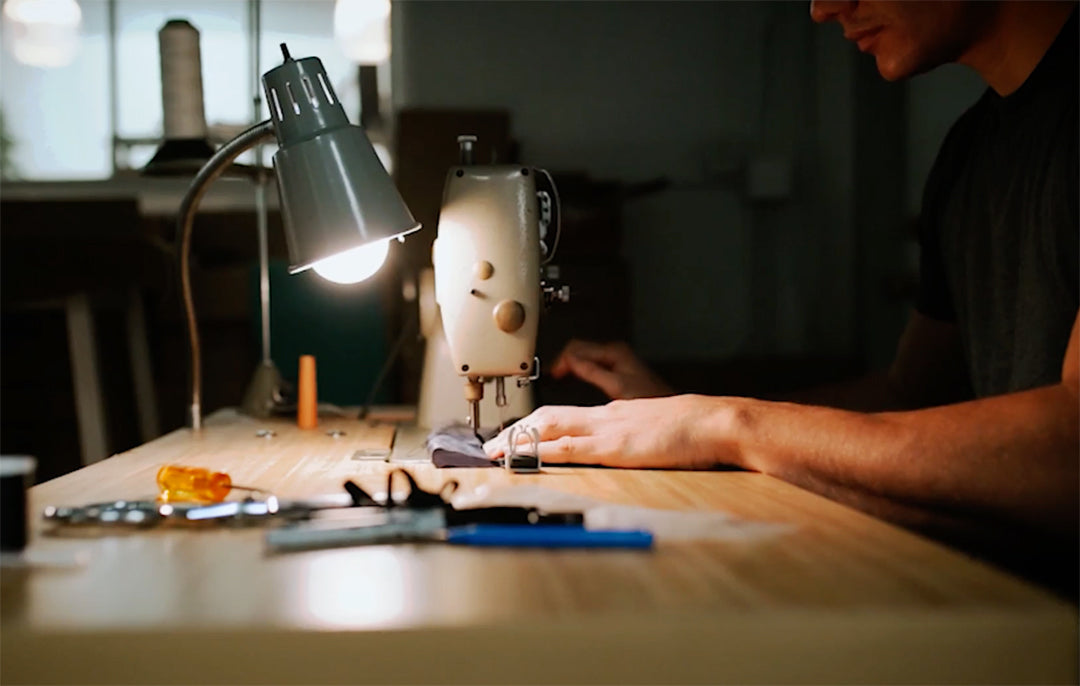 person sewing a pocket blanket on a machine