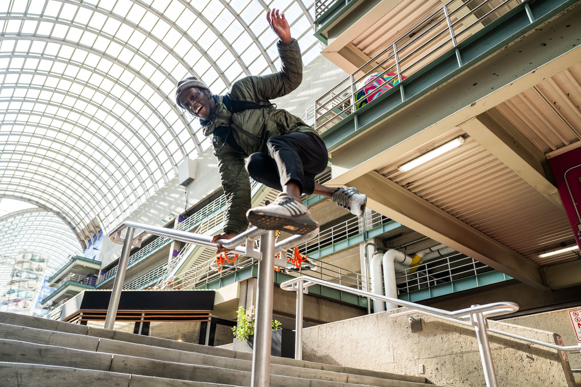 man jumping over a railing
