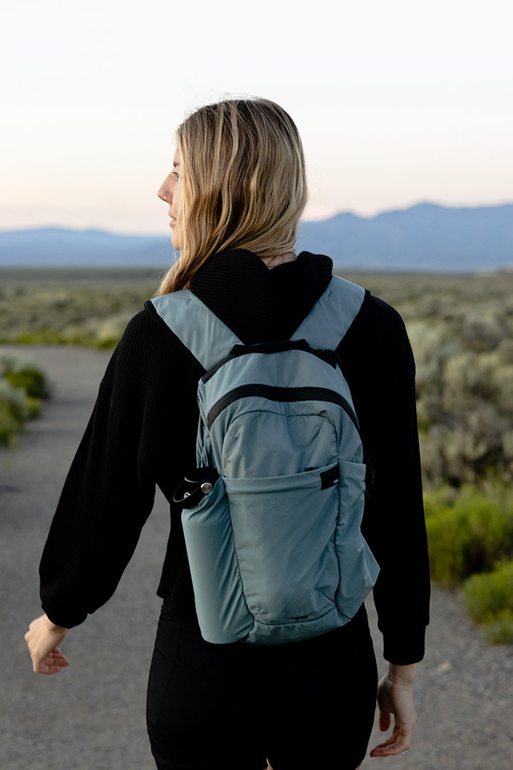 person walkin on a trail with a backpack in new mexico