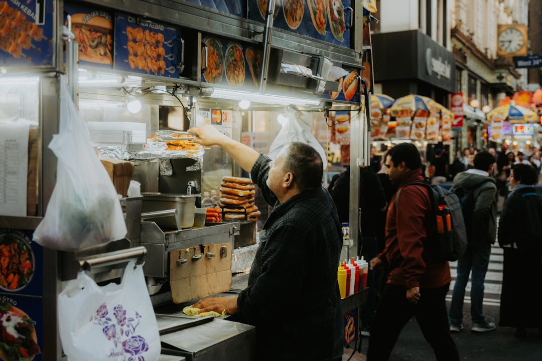 a man as a sanitary street food guide